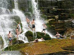 Taking a shower at Aruu falls.